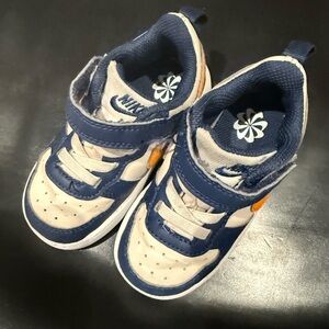 Nike Kids Navy and White Sneakers with Orange Accent